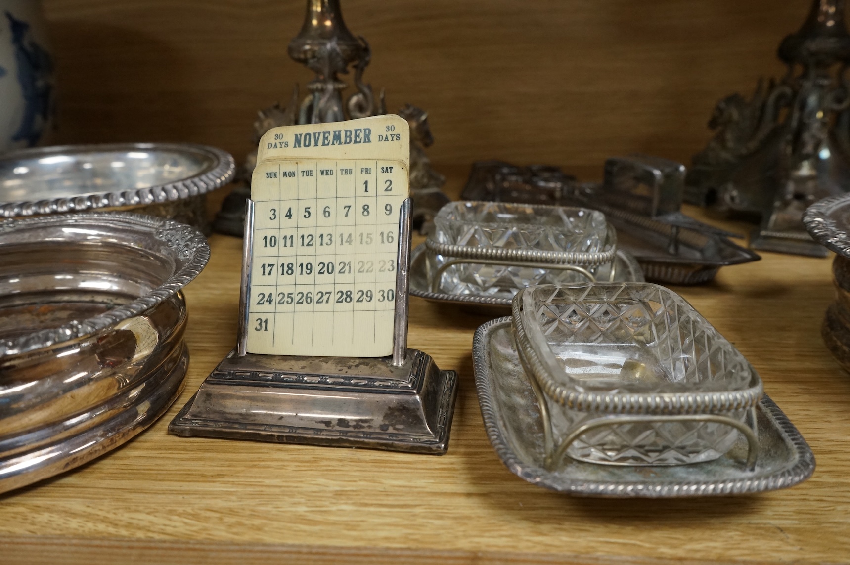 Pair of Victorian plated centerpieces and a small collection of other plated wares to include wine coasters, largest 18cm high